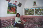 Beaming tourist inside a Nubian home